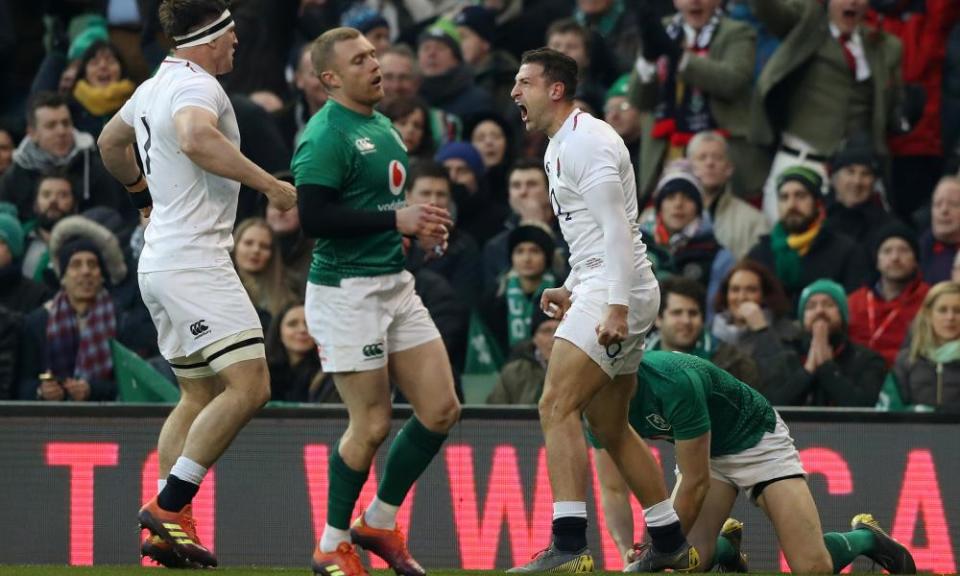 Jonny May (right) celebrates England’s first try at the Aviva Stadium.