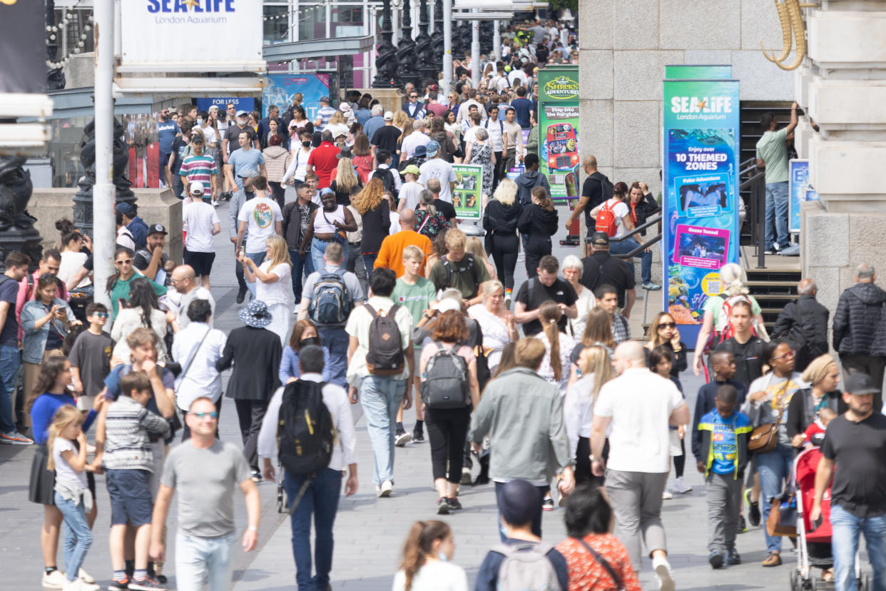 Crowds walk along Southbank, central London, as the capital experiences warm weather. Picture date: Monday July 4, 2022.