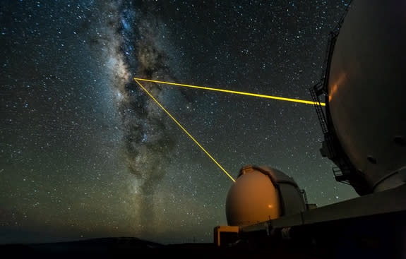 The two W. M. Keck Telescopes on Mauna Kea, Hawaii, observing the galactic center. The lasers are used to create an artificial star in Earth's upper atmosphere, which is then employed to measure the blurring effects of the lower atmosphere (the