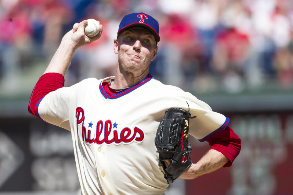 File-This Aug. 25, 2013, file photo shows Philadelphia Phillies starting pitcher Roy Halladay throwing a pitch during the third inning of a baseball game in Philadelphia. Halladay, an ace with the Toronto Blue Jays and Philadelphia Phillies, got 85.4 percent and will be the first posthumous inductee since Deacon White in 2013 and Ron Santo in 2012. Halladay died in November 2017 at 40 years old when an airplane he was flying crashed into the Gulf of Mexico off the coast of Florida. (AP Photo/Christopher Szagola, File)