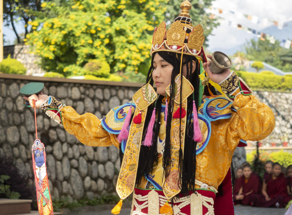 In this photo provided by the Dongyu Gatsal Ling nunnery, a Dakini dancer in full attire performs movements of the ritual dance at the nunnery in the state of Himachal Pradesh, India on Oct. 27, 2021. Women were included in Buddhism since its earliest years, and their monastic ordination dates back more than 2,500 years, said Judith Simmer-Brown, emeritus professor of contemplative and religious studies at Colorado’s Naropa University. But as monasticism spread from India to other countries, there often were extra requirements to become ordained in those patriarchal societies. (Dongyu Gatsal Ling nunnery via AP)