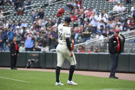 Minnesota Twins pitcher Pablo Lopez acknowledges fans as he leaves during the seventh inning of a baseball game against the Seattle Mariners, Thursday, May 9, 2024, in Minneapolis. The Twins won 11-1. (AP Photo/Craig Lassig)