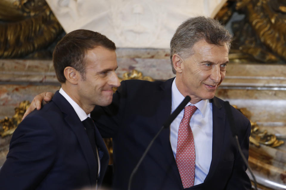 France's President Emmanuel Macron, left, and Argentina's President Mauricio Macri smile at the end of a joint press conference at the presidential palace in Buenos Aires, Argentina, Thursday, Nov. 29, 2018. Macron will attend the G20 two-day summit starting Friday. (AP Photo/Natacha Pisarenko)