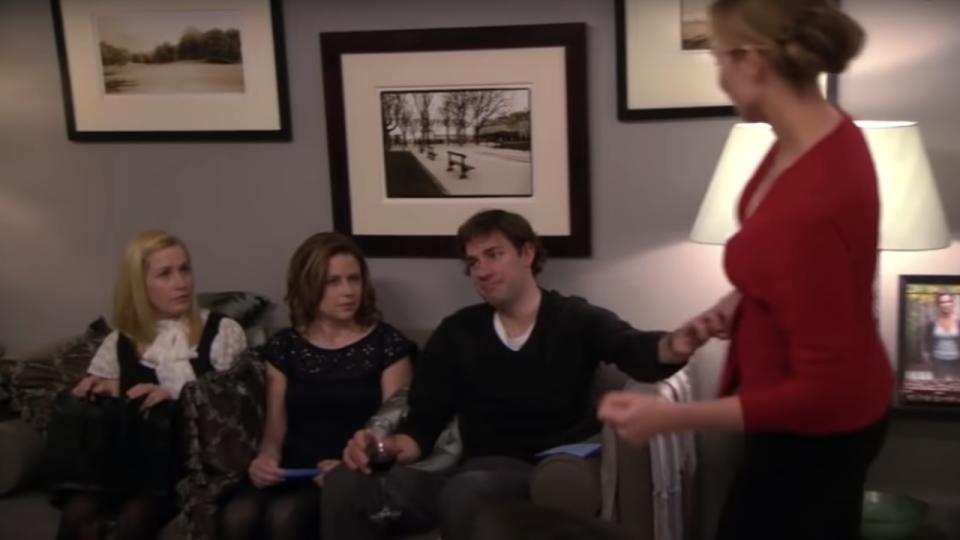 Jim, Pam and Angela sitting on a couch in The Office