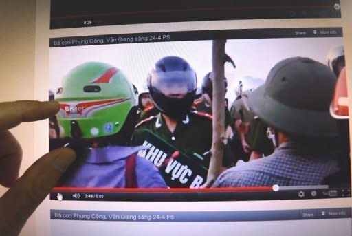 A man watches a video posted on the blog of Dr. Nguyen Xuan Dien showing villagers challenging policemen during forced land evictions in Van Giang district in April 2012. These shaky images spread like wildfire on Facebook, in a sign of growing online defiance in Vietnam