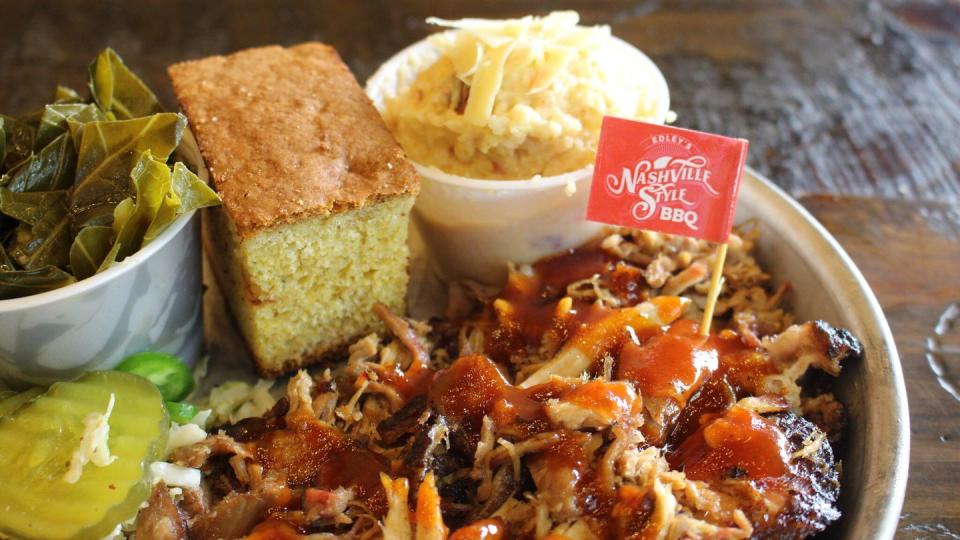 a plate of nashville style hot bar b que with sides