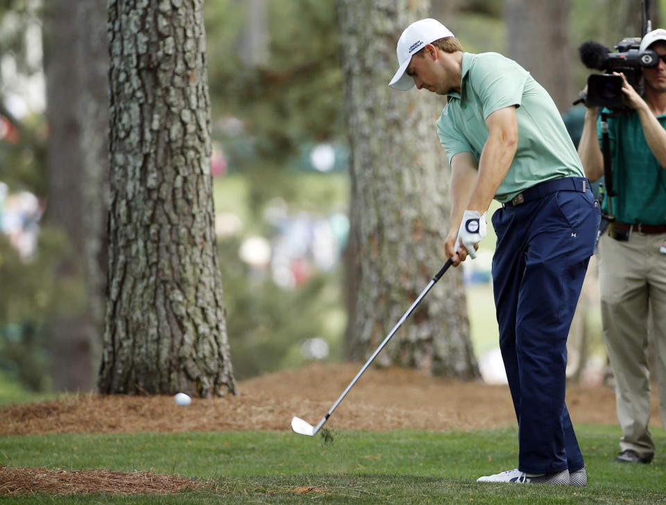 Jordan Spieth hits out of the rough off the first fairway during the fourth round of the Masters golf tournament Sunday, April 13, 2014, in Augusta, Ga. (AP Photo/David J. Phillip)