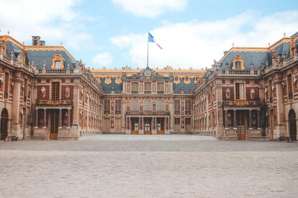 A wide shot of the Palace of Versailles.