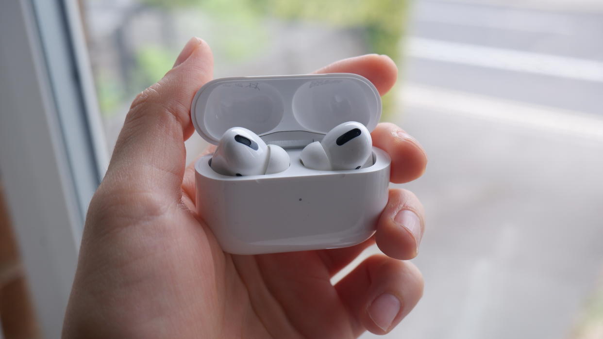  The AirPods Pro being held in hand. 