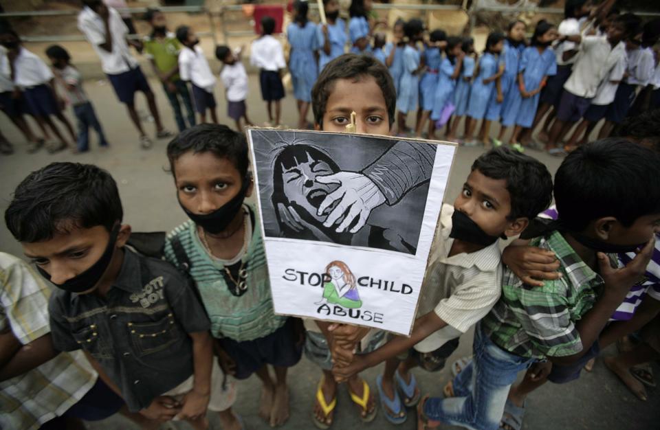 Indian children participate in a protest against child abuse and rising crimes against women, in Bhubaneswar, India, Saturday, March 16, 2013. India has seen outrage and widespread protests against rape and attacks on women and minors since a fatal gang-rape of a young woman in December on a moving bus in New Delhi, the capital. In the most recent case, a Swiss woman who was on a cycling trip in central India with her husband has been gang-raped by eight men, police said. (AP Photo/Biswaranjan Rout)