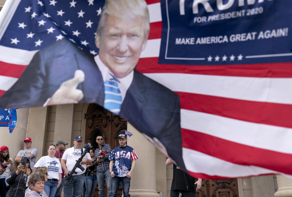 Trump supporters gather on the steps of the State Capitol to protest the presidential election results in Lansing, Mich., Sunday, Nov. 8, 2020. (AP Photo/David Goldman)