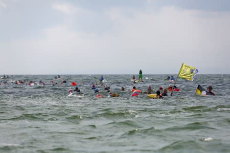 People take part in the annual event called the Herring March in Puck Bay