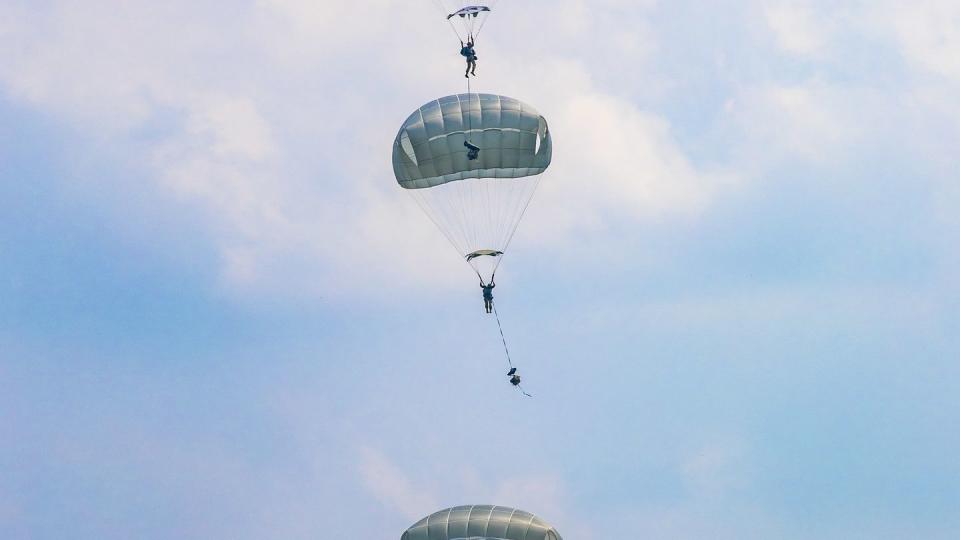 U.S. Army soldiers and Indonesia airborne troops conduct a joint forcible entry operation at Baturaja Training Area on Aug. 4, 2021. (Staff Sgt. Thomas Calvert/U.S. Army)