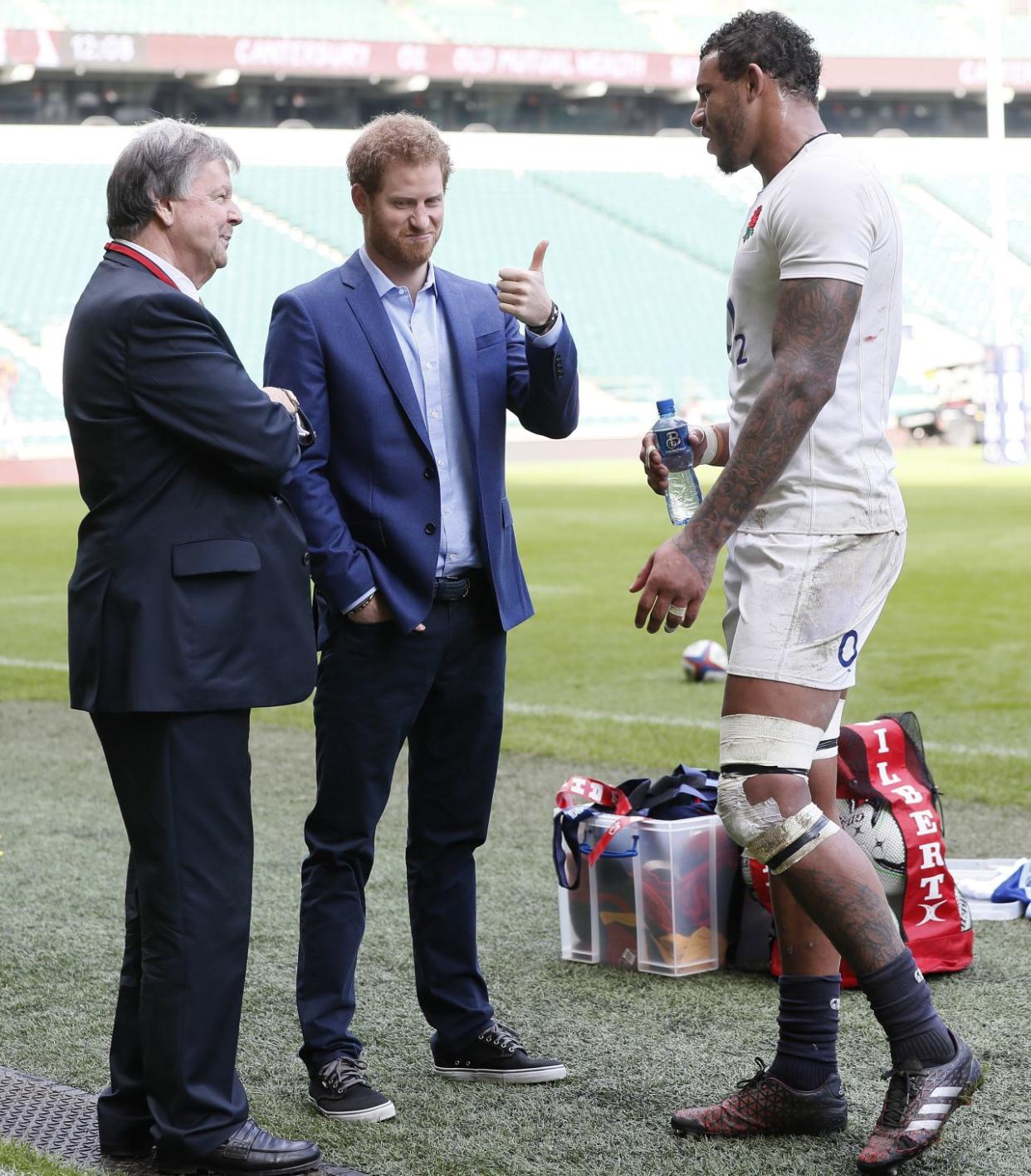 LONDON, ENGLAND - FEBRUARY 17: Prince Harry, (C) speaks with England player Courtney Lawes, (R) and Ian Richie, CEO of the RFU, during a visit to an England Rugby Squad training session at Twickenham Stadium on February 17, 2017 in London, England. In his new role as Patron of the Rugby Football Union (RFU), Prince Harry attended the England rugby team open training session. (Photo by Kirsty Wigglesworth - WPA Pool/Getty Images)