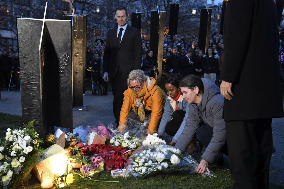 People take part in a vigil at the New Zealand War Memorial on Hyde Park Corner in London. Other members of Britain&rsquo;s royal family have followed Queen Elizabeth II in expressing their sadness over the shootings in Christchurch, New Zealand. In a joint statement, Princes William and Harry, together with their spouses, the Duchess of Cambridge and the Duchess of Sussex, said that their hearts go out to those who lost their lives in the mosque shootings.