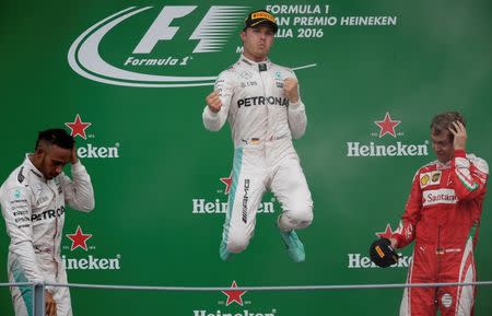 Formula One - F1 - Italian Grand Prix 2016 - Autodromo Nazionale Monza, Monza, Italy - 4/9/16 Mercedes' Nico Rosberg celebrates his win on the podium after the race Reuters / Max Rossi Livepic