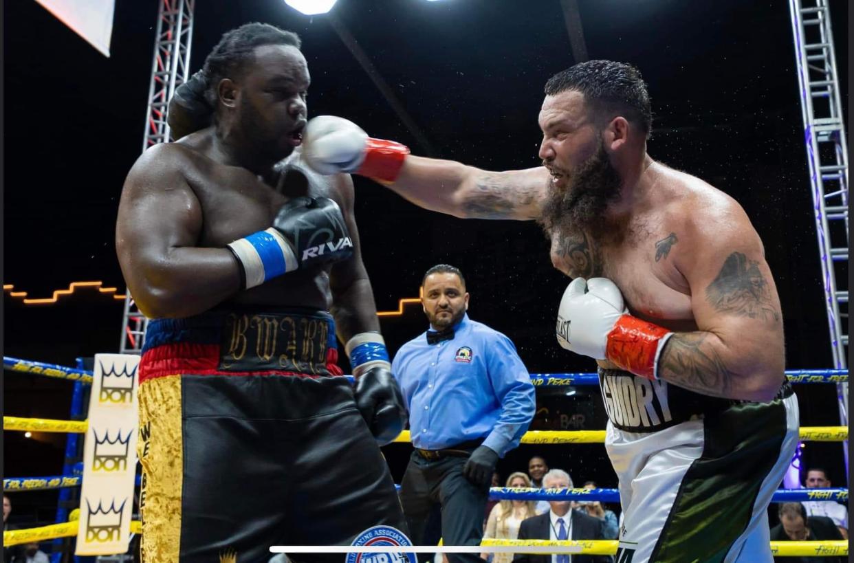 Jonathan "The King" Guidry, 33, lands a punch against Bermane “B. WARE” Stiverne during their fight in Miami Florida on Jan. 21, 2023. Guidry, a shrimper from Dulac, retained his North American Boxing Association Gold Title after a 10-round unanimous decision.