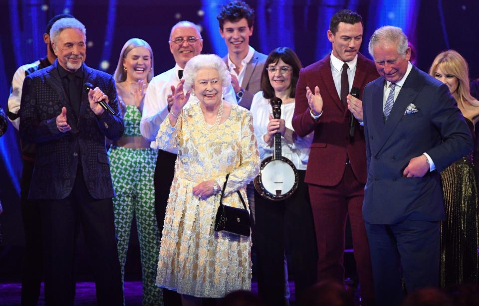 Britain's Prince Charles, Prince of Wales (R) and his mother Britain's Queen Elizabeth II join the performers on stage during The Queen's Birthday Party concert on the occassion of Her Majesty's 92nd birthday at the Royal Albert Hall in London on April 21, 2018. (Photo by Andrew Parsons / POOL / AFP)        (Photo credit should read ANDREW PARSONS/AFP via Getty Images)