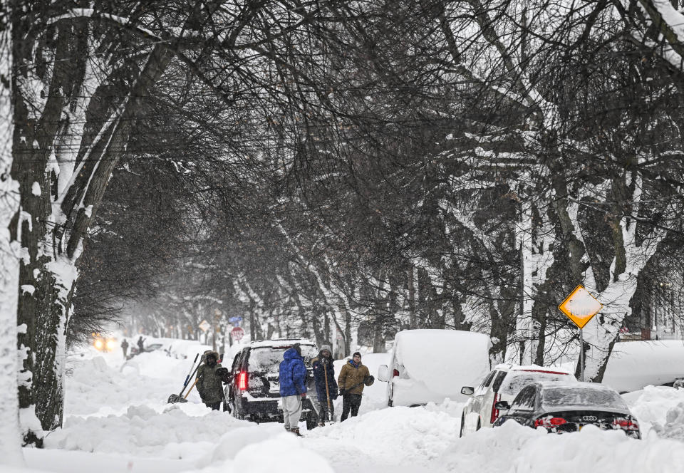 People shovel snow in Buffalo, N.Y. on Dec. 26, 2022. / Credit: Fatih Aktas / Anadolu Agency via Getty Images