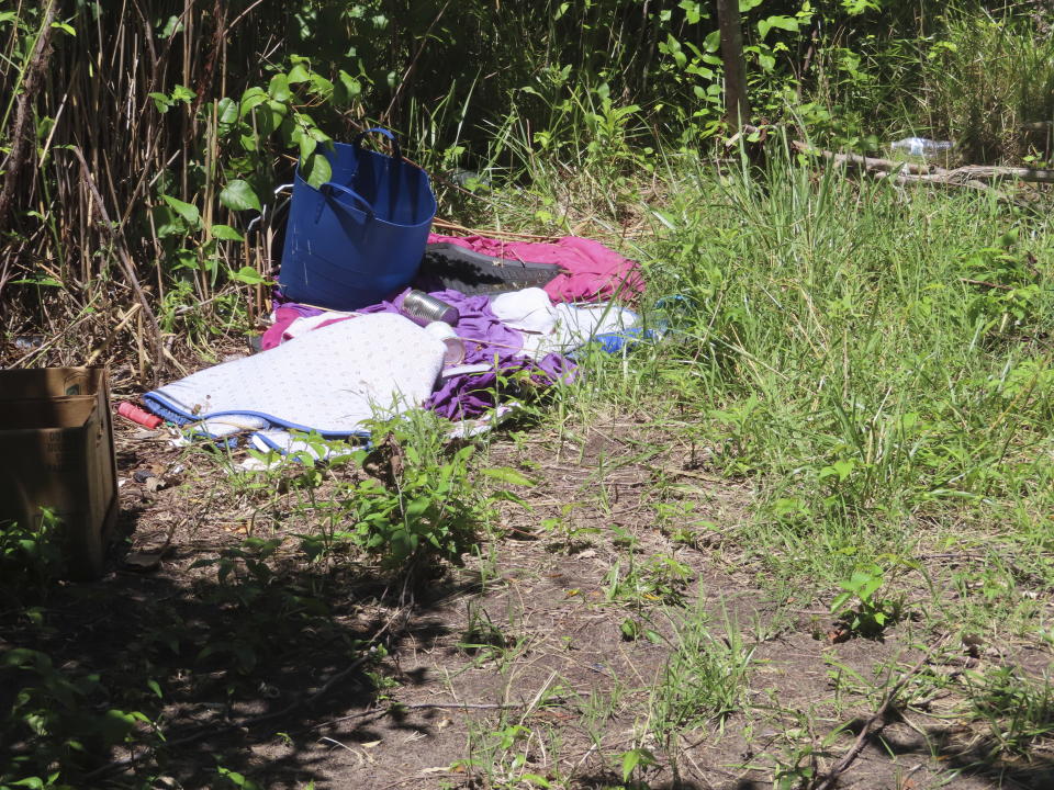 Clothing and other supplies lie on the ground in a homeless encampment in Atlantic City, N.J., on Monday, on July 1, 2024, the date city officials announced implementation of programs to address homelessness. (AP Photo/Wayne Parry)