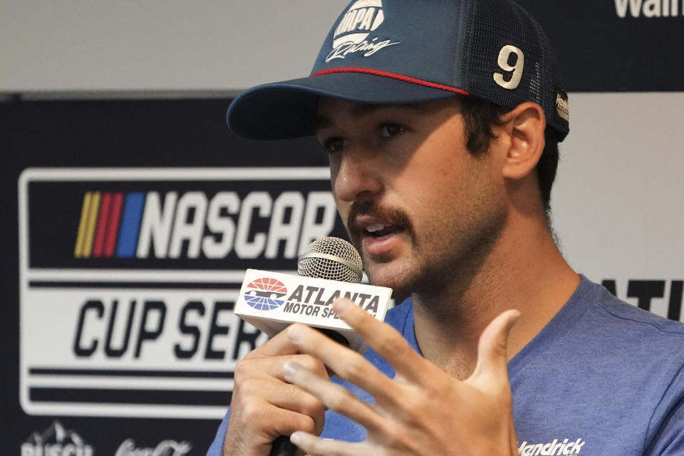 FILE - Driver Chase Elliott speaks to the media during a weather delay before qualifying the NASCAR Cup Series auto race at Atlanta Motor Speedway in Hampton, Ga., on Saturday, July 9, 2022. The regular-season champion's day was done early after a wreck at Darlington that sent him tumbling down the playoff standings, leaving Elliott white-knuckling his way into Kansas Speedway for Sunday's second postseason race. (AP Photo/Bob Andres, File)