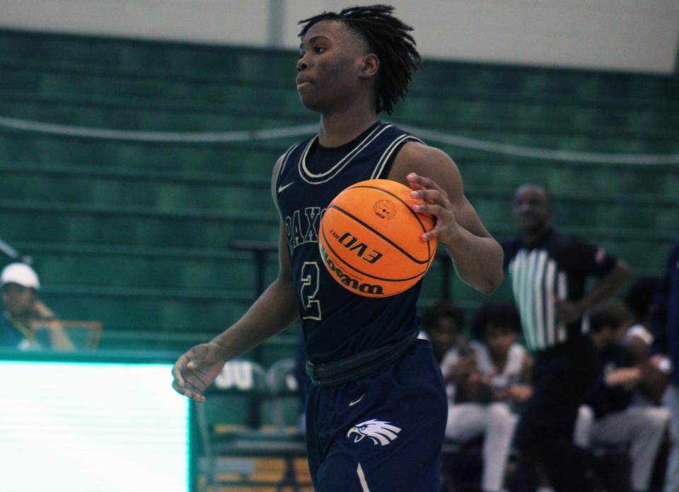 Paxon guard Dameon Jones (2) dribbles up the court against University Christian during the Sun Bash.