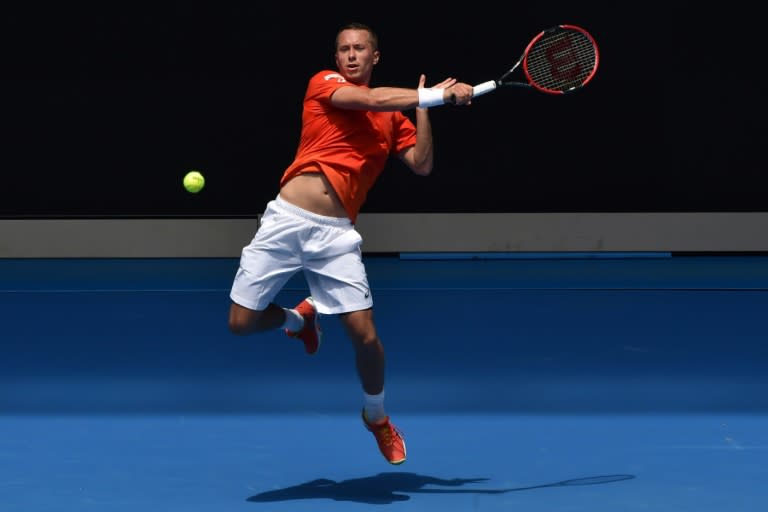 Germany's Philipp Kohlschreiber hits a return against Japan's Kei Nishikori during their men's singles first round match of the Australian Open, in Melbourne, on January 18, 2016