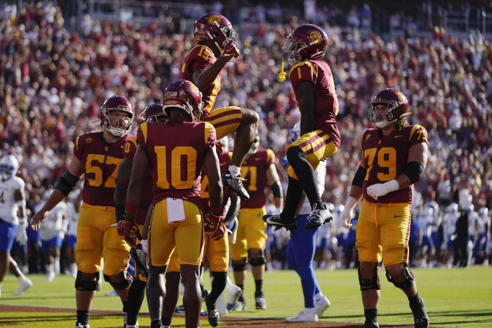 Southern California wide receiver Dorian Singer (15) celebrates his touchdown against San Jose State with Zachariah Branch (1) during the first half of an NCAA college football game in Los Angeles, Saturday, Aug. 26, 2023. (AP Photo/Jae C. Hong)