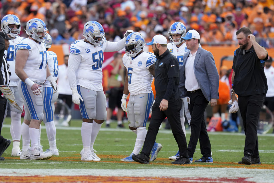 David Montgomery landed awkwardly after a 19-yard reception in the first half Sunday in Florida. (AP/Chris O'Meara)