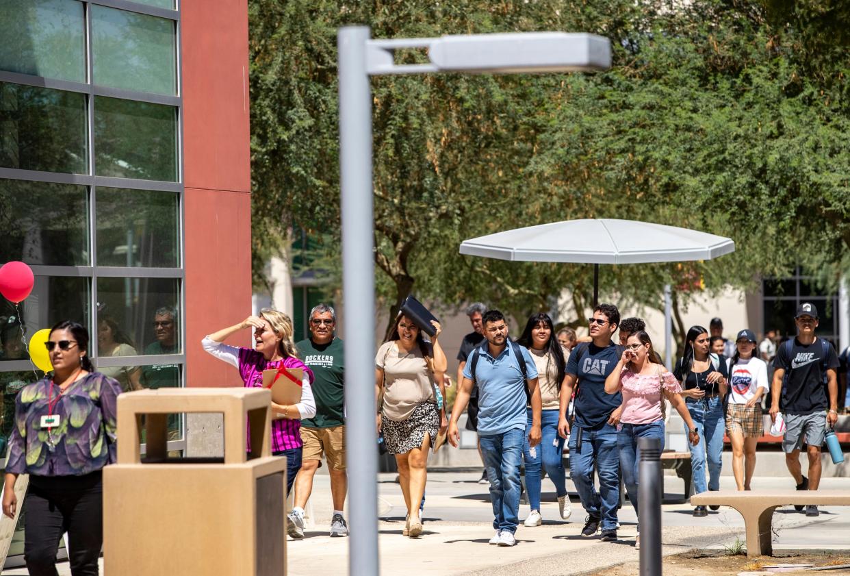 Students walk over to the back to school service fair at College of the Desert in Palm Desert, Calif., Wednesday, Aug. 31, 2022. 
