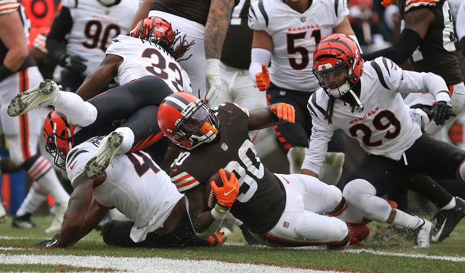 Cleveland Browns running back D'Ernest Johnson (30) dives into the end zone to score a trouchdown during the first half of an NFL football game against the Cincinnati Bengals, Sunday, Jan. 9, 2022, in Cleveland, Ohio. [Jeff Lange/Beacon Journal]