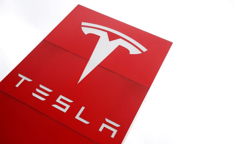 FILE PHOTO: The logo of car manufacturer Tesla is seen at a dealership in London