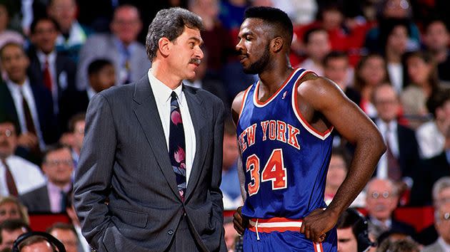 Jackson, then coach of the Chicago Bulls, and Oakley catch up during a game in 1991. Pic: Getty