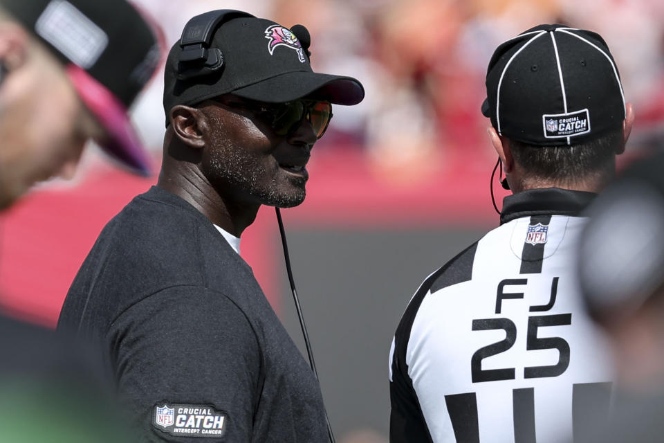 Tampa Bay Buccaneers head coach Todd Bowles speaks with field judge Ryan Dickson (25) during the first half of an NFL football game against the Atlanta Falcons, Sunday, Oct. 22, 2023, in Tampa, Fla. (AP Photo/Mark LoMoglio)