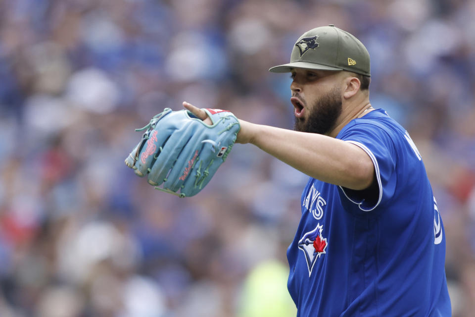 Toronto Blue Jays starting pitcher Alek Manoah (6) yells at Baltimore Orioles batter Adam Frazier (12) in the sixth inning of a baseball game in Toronto, Saturday, May 20, 2023. (Cole Burston/The Canadian Press via AP)