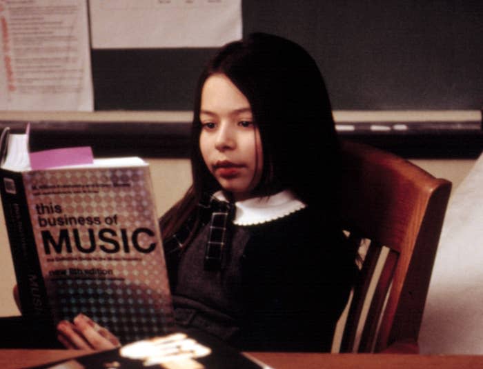 Summer sits reading a book called "The Business of Music"