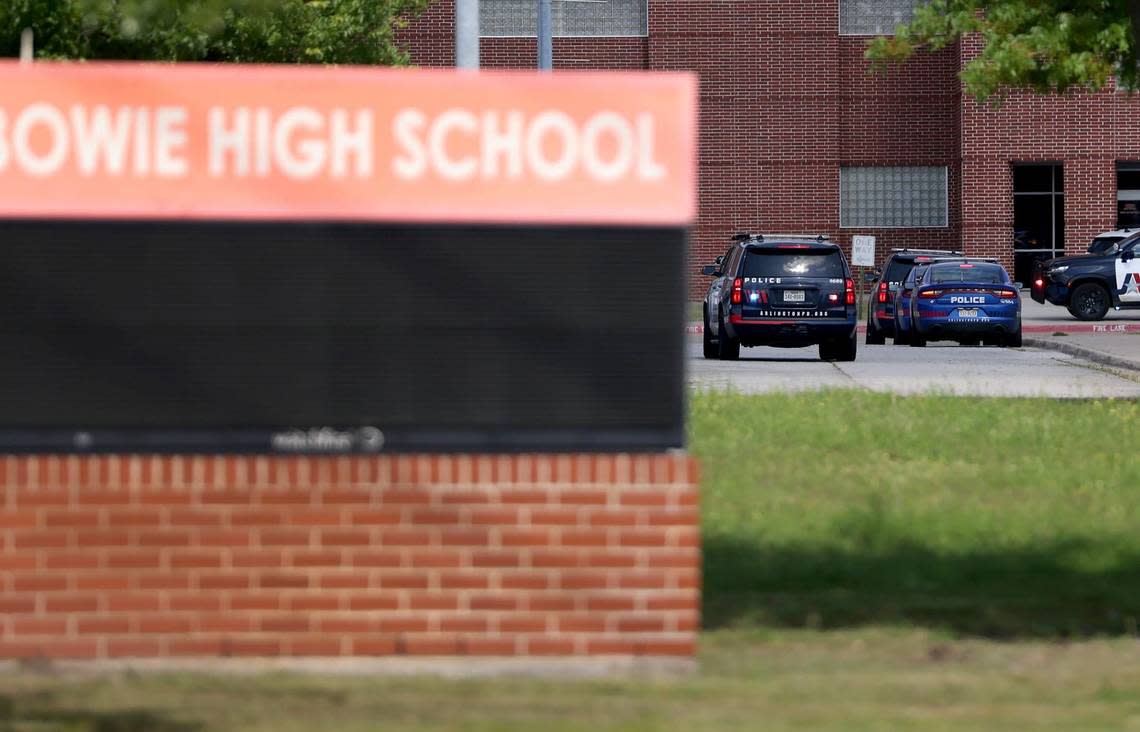 Emergency personnel investigate a shooting outside of Bowie High School in Arlington on Wednesday, April 24, 2024.