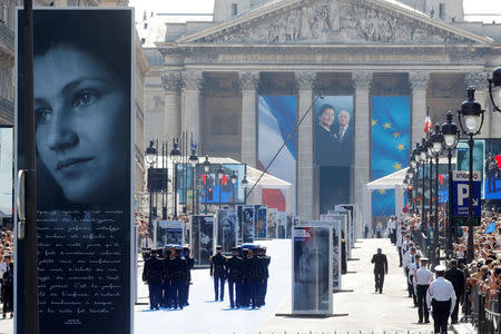 The flag-draped coffins of late Auschwitz survivor and French health minister Simone Veil and her late husband Antoine Veil are carried by members of the French Gardes Republicains during a national tribute before being laid to rest in the crypt of the Pantheon mausoleum, in Paris, France, July 1, 2018. REUTERS/Philippe Wojazer