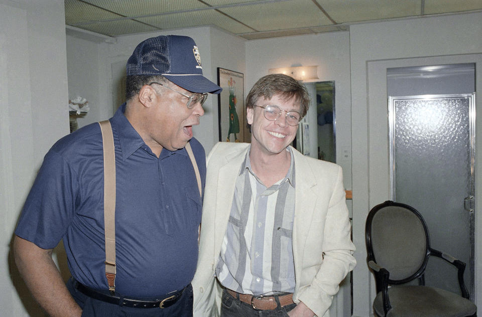 James Earl Jones, left, gets a hug Mark Hamill backstage after Jones finished a performance in the Broadway hit 