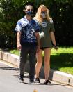 <p>Parents-to-be Joe Jonas and Sophie Turner go arm-in-arm for a walk in Los Angeles on Wednesday.</p>