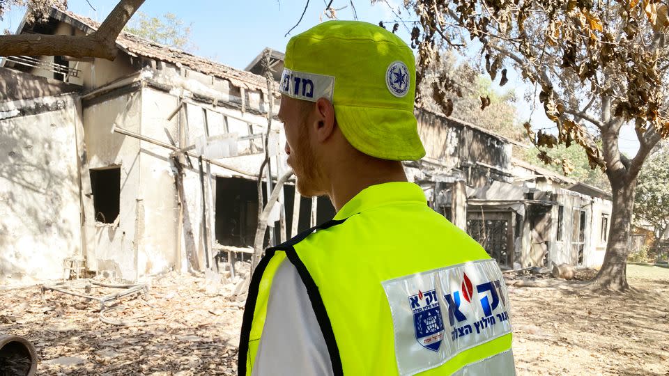 Eli Landau looks towards a house destroyed by Hamas in Be'eri on October 20, 2023. - Ivana Kottasova/CNN