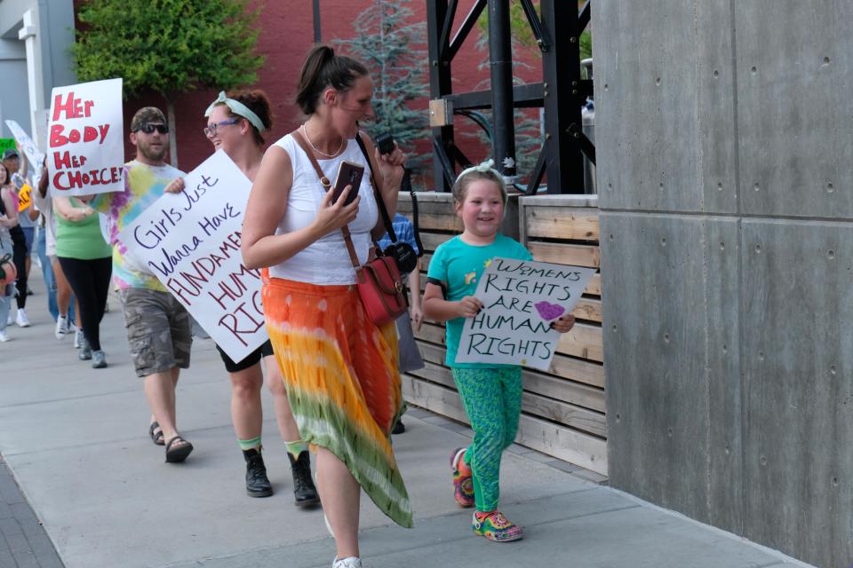 Rally organizer and founder of Panhandle Activist Coalition Jami Lyons leads a group of protesters in pro-choice chants Thursday evening in downtown Amarillo.