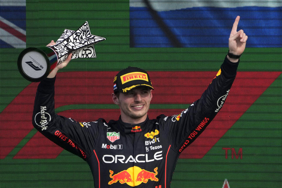 Red Bull driver Max Verstappen of the Netherlands lifts his trophy on the podium after winning the Formula One Dutch Grand Prix auto race, at the Zandvoort racetrack, in Zandvoort, Netherlands, Sunday, Sept. 4, 2022. (AP Photo/Peter Dejong)