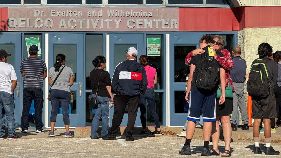 Melissa Bowman reunites with her 18-year-old son Oliver Douglass at the Delco Activity Center after a shooting near Northeast Early College High School on Tuesday. - Jay Janner/Austin American-Statesman/USA Today Network