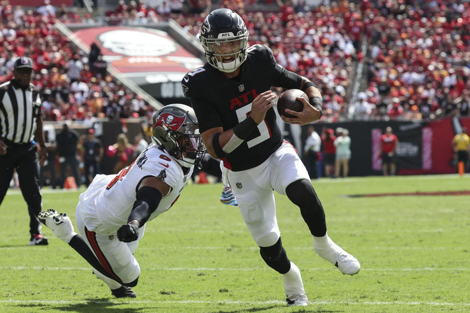 Atlanta Falcons quarterback Desmond Ridder (9) runs into the end zone for a touchdown against the Tampa Bay Buccaneers during the first half of an NFL football game, Sunday, Oct. 22, 2023, in Tampa, Fla. (AP Photo/Mark LoMoglio)