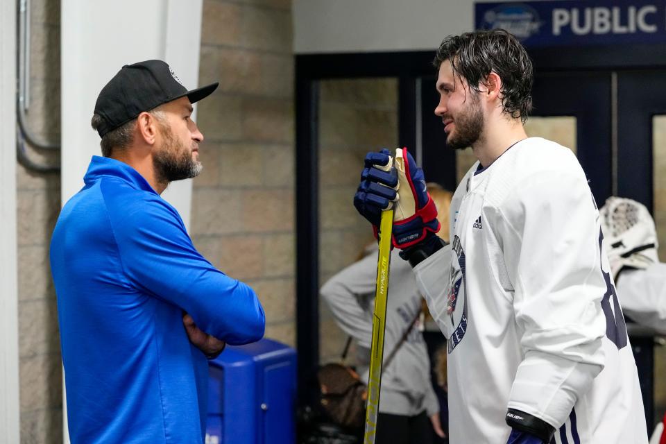 Jul. 13, 2022; Lewis Center, OH USA;  Forward Kirill Marchenko (86) talks to former Columbus Blue Jackets defenseman Fedor Tyutin during development camp at the OhioHealth Chiller North in Lewis Center on July 13, 2022. Mandatory Credit: Adam Cairns-The Columbus Dispatch