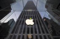 The leaf on the Apple symbol is tinted green at the Apple flagship store on 5th Ave in New York in this file photo taken on April 22, 2014. REUTERS/Brendan McDermid