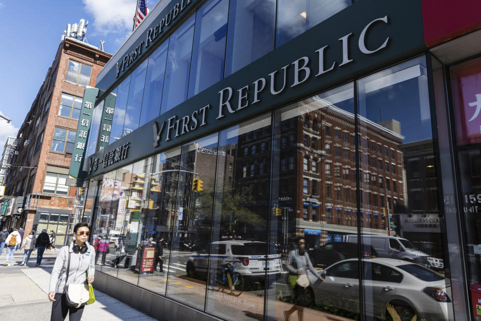 People walk past a First Republic Bank in New York, Monday, May 1, 2023. Regulators seized the troubled First Republic Bank early Monday, making it the second-largest bank failure in U.S. history, and promptly sold all of its deposits and most of its assets to JPMorgan Chase in a bid to stop further banking turmoil that has dominated the first half of this year. (AP Photo/Stefan Jeremiah)