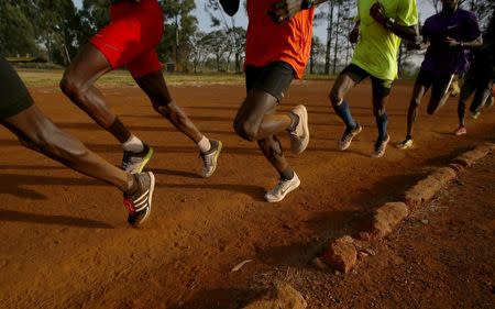 Athletes exercise in the early morning in the sports ground of the University of Eldoret in western Kenya, March 21, 2016. REUTERS/Siegfried Modola