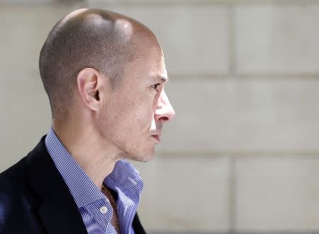 Founder and former Chief Executive of Spanish wireless networks provider Gowex Jenaro Garcia waits for a taxi in central Madrid in this July 10, 2014 file photo. REUTERS/Javier Barbancho/Files